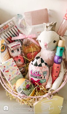 a pink basket filled with lots of items