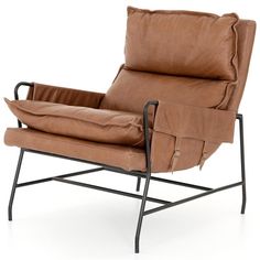 a brown leather chair sitting on top of a black metal frame with a pillow in the back