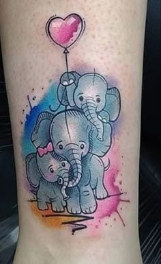 an elephant family with a heart balloon tattoo on the leg, done in watercolor