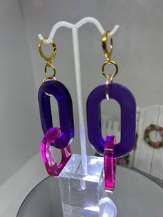 Purple and pink lightweight resin, fun, earrings with gold findings. Trendy Pink Plastic Jewelry, Trendy Pink Resin Jewelry, Pink Plastic Drop Earrings, Trendy Pink Plastic Earrings, Trendy Purple Plastic Jewelry, Pink Plastic Earrings For Party, Pink Plastic Party Earrings, Bold Pink Earrings For Party, Bold Pink Party Earrings