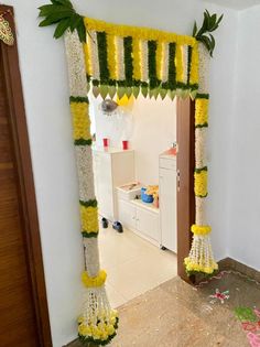 an entrance decorated with yellow and white flowers