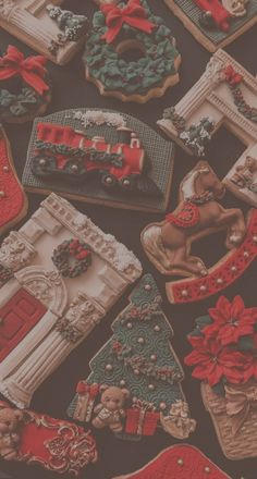 many decorated cookies are on a table