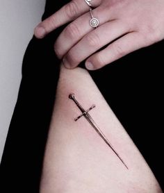 69 Striking Dagger Tattoos With Meaning - Our Mindful Life Dagger Tattoo Meaning, Feminine Dagger Tattoo, Rose And Dagger Tattoo, Snake And Dagger Tattoo, Dagger Tattoos, Traditional Dagger Tattoo, Feminine Shoulder Tattoos, Matching Friend Tattoos, Our Mindful Life