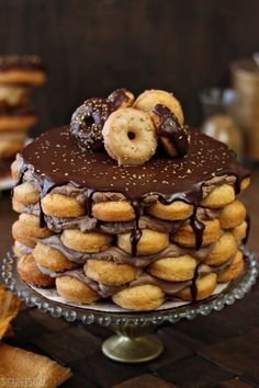 there is a chocolate cake with donuts on top