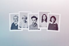 five old photos of people hanging on a wall