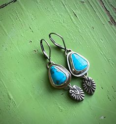 Beautiful Pilot Mountain turquoise earrings hand fabricated in my shop, even the dangle charms. Made from sterling and fine silver, all soldered and finished with a soft patina.  My makers mark is on the back, stamped with 'sterling'. These hang from sterling silver leverbacks so you'll never lose these beauties! 1- 3/4" from the top to bottom 1/2" wide. © Gooseberry Studi 2023 Artisan Turquoise Nickel-free Earrings, Artisan Nickel-free Turquoise Earrings, Adjustable Blue Oxidized Finish Jewelry, Artisan Teardrop Beads For Jewelry Making, Artisan Teardrop Jewelry For Jewelry Making, Artisan Turquoise Drop Earrings Jewelry, Artisan Turquoise Pierced Earrings, Artisan Turquoise Jewelry With Matching Earrings, Nickel-free Teardrop Turquoise Jewelry