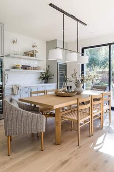 a dining room table and chairs in a kitchen