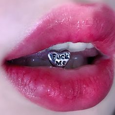 a woman's lips with the word kiss me written on it