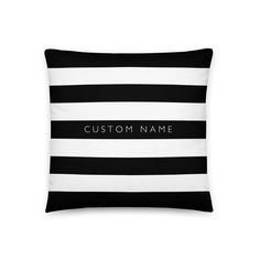 a black and white striped pillow with the word custom on it's front side