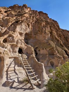 a ladder leading up to a cave entrance