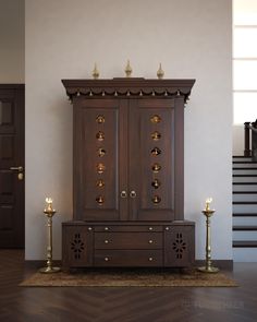 a large wooden cabinet sitting on top of a hard wood floor next to a stair case