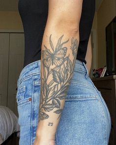 a woman with a tattoo on her arm