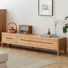 a living room scene with focus on the entertainment center and coffee table in the foreground