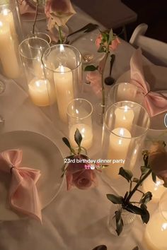 the table is set with candles and flowers