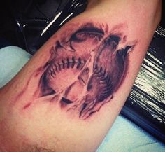 a baseball and skull tattoo on the leg