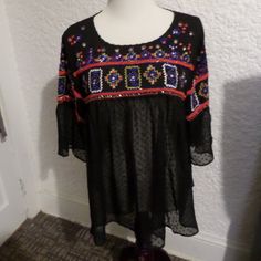 Gorgeous Semi Sheer Body With Embroidered And Beaded Yoke And Sleeves Back Keyhole Button Neckline Aztec Print Beading & Embroidery Semi Sheer Pin Dot Print Beneath The Yoke Available In Size L New With Tags - Retail $70 Polyester Length From Shoulder To Bottom Hem - 25.5" Bohemian Embroidered Top For Party, Black Summer Blouse With Geometric Embroidery, Bohemian Floral Embroidered Top For Party, Black Bohemian Tops With Sequins, Fitted Black Bohemian Embroidered Top, Black Fitted Bohemian Embroidered Top, Black Blouse With Geometric Embroidery For Summer, Black Bohemian Top With Sequins, Black Bohemian Sequin Tops