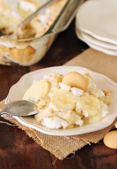 a white plate topped with dessert next to cookies