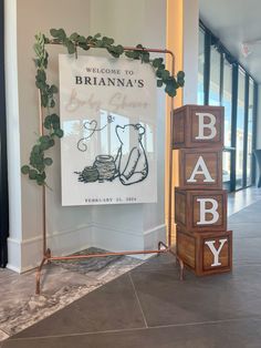 a welcome sign and baby blocks are on display