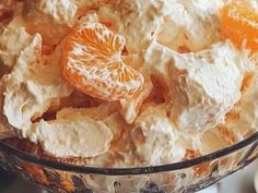 a bowl filled with orange slices and cream