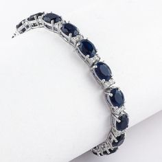 Introducing our Blue Sapphire Tennis Small Oval Silver Bracelet - a perfect blend of elegance and style. This exquisite piece of jewelry is handcrafted with utmost precision, making it a unique addition to your collection or a thoughtful gift for your loved ones. Key Features Handmade Jewelry: Each bracelet is meticulously handcrafted, ensuring a level of detail and quality that is truly unparalleled. 925 Sterling Silver: Made with 925 Sterling Silver, this bracelet offers durability and longevi Elegant Sterling Silver Bracelet With Sapphire, Elegant Sterling Silver Sapphire Bracelet, Luxury Sapphire Oval Bracelets, Elegant Sapphire Sterling Silver Bracelet, Elegant Sterling Silver Bracelet With Oval Gemstone, Elegant Sterling Silver Oval Gemstone Bracelet, Elegant Sapphire Sterling Silver Bracelet As Gift, Formal Sapphire Oval Bracelets, Formal Sapphire Oval Bracelet