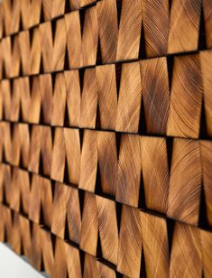 a wall made out of wooden planks with wavy lines on the top and bottom