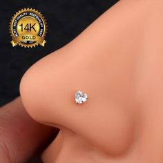 a close up of a fake breast with a diamond on it