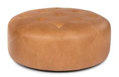 a round leather ottoman with buttons on the top and bottom, shown in light brown