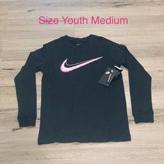 Nwt- Nike Long Sleeve Tee ~Size Medium (Youth) ~Standard Fit ~Smoke/Pet Free Home Nike Long Sleeve T-shirt For Spring, Nike Black T-shirt For Spring, Nike Graphic Print Tops For Winter, Nike Winter Graphic Print Tops, Nike Graphic Print Winter Tops, Nike Winter Tops With Graphic Print, Black Snug Fit Cotton Tops, Snug Fit Black Cotton Tops, Black Cotton Snug Fit Tops