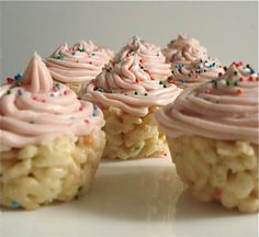 several cupcakes with pink frosting and sprinkles