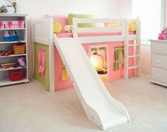 a child's bedroom with bunk beds and a slide in the middle, pink walls