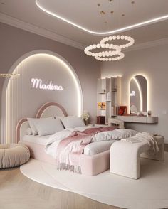 a large white bed sitting inside of a bedroom next to a round table and chair