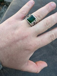 Mens Real solid 925 silver green emerald ring.
Nice medium/large rectangular stone
 
Very classy design that can be worn everyday with any outfit!
Solid 925 sterling silver. Stamped 925
Man made dark green emerald..looks just like natural emerald and cant tell difference without a microscope
Ruby symbolize truth and loveStone measures 11x13mmNo two ring are alike...gorgeous handmade item!Weighs roughly 8 grams depending on ring sizeCan be worn as a signet ring or as a pinky ring. Even Green Rectangular Signet Ring For Formal Occasions, Rectangular Sterling Silver Emerald Ring For Formal Occasions, Classic Silver Emerald Ring With Rectangular Stone, Green Rectangular Sterling Silver Jewelry, Classic Green Signet Ring Stamped 925, Rectangular Green Emerald Ring In Sterling Silver, Green Emerald Cut Signet Ring With Polished Finish, Green Emerald-cut Signet Ring With Polished Finish, Modern Green Emerald Cut Signet Ring