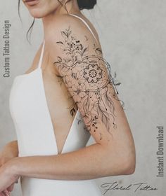 a woman with a flower tattoo on her arm and shoulder is looking at the camera