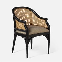 a black and beige chair with cane backrests on an isolated white background in the style of louis ii