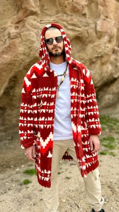 Indulge in unparalleled comfort and style with our men's hooded cardigan. Crafted from luxuriously soft double-sided faux fur, this piece offers a lavish embrace. Adorned with striking southwestern patterns, it evokes the spirit of the desert landscape. Whether you're lounging at home or venturing out, this cardigan promises warmth and sophistication wherever you go.  Every piece is made to the order and 100% handmade. Native American Pattern, Faux Fur Cardigan, Faux Fur Hooded Coat, Native American Patterns, Fur Cardigan, American Pattern, Southwestern Patterns, Hooded Faux, Hooded Cardigan