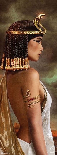 an egyptian woman with tattoos and headdress