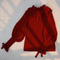 Size 			S 			M 			L 		 		 			Full Length 			56 			58 			60 		 		 			Bust 			80 			84 			88 		 		 			Waist 			70 			74 			78 		 		 			Neck Circumference 			18 			19 			20 		 		 			Sleeve Length 			58 			59 			60 Red Long Sleeve Knit Top For Spring, Ruffled Knit Top For Fall, Fall Ruffled Knit Tops, Fall Knit Tops With Ruffles, Fall Knit Ruffle Tops, Fitted Red Knit Top For Fall, Long Sleeve Sweater With Ruffles For Fall, Red Long Sleeve Knit Top For Winter, Red Long Sleeve Knit Top For Fall