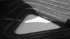 a black and white photo of an air mattress with water in the bottom section, as seen from above