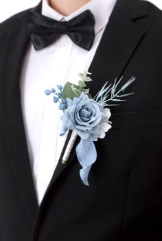 a man in a tuxedo with a boutonniere on his lapel