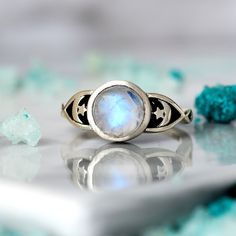 magical star and moon ring with a shimmering moonstone gem as the centerpiece. The intricate details of the design combined with the radiant moonstone make this ring a truly mesmerizing piece of jewelry. Ideal for anyone who loves celestial-inspired accessories.  Made of sterling silver. This ring features a natural, genuine, unique Moonstone gemstone handpicked from our current collection. The actual gemstone you receive will be one-of-a-kind and may be different from the photos, making your ri Silver Rings For Women, Moonstone Ring Sterling Silver, Star And Moon, Stars Moon, Moon Ring, Celestial Jewelry, Cute Rings, Ring Boho, Unique Gemstones