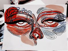 a drawing of a face with red and black lines on it