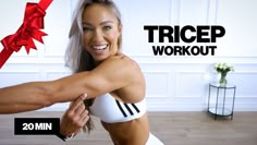 a woman in a white bra top and red ribbon on her arm, with the words'tricep workout '