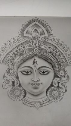 a pencil drawing of a woman's face with an ornate headdress on it