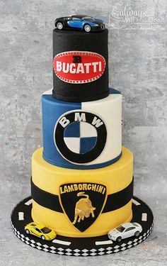 a three tiered cake decorated with cars and the words bugatti on it