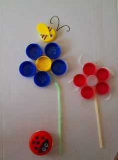 two plastic cups, one with a flower and the other with a bee on it