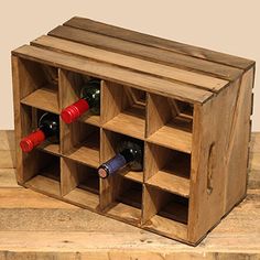 a wooden wine rack with several bottles in it