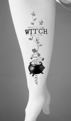 a woman's leg with a tattoo that reads, there is a witch on it