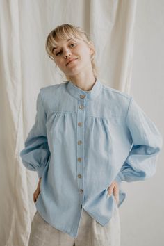 "100% linen shirt for women. A beautiful, vintage inspired linen shirt with long ruffled balloon sleeves and buttons at the front. Perfect for different looks: try wearing it with a pair of jeans for a smart look or a linen bottoms like a skirt for a romantic look. Available in sky blue and creamy white.   <> Ugnė is 180cm/5'9\" and wearing size S in Creamy White Elžbieta is 165cm/ 5'4\" and wearing size S in Sky Blue Details: - This listing is for linen shirt Indraja - Made using 100% OEKO Tex Relaxed Fit Linen Blouse With Ruffles, Spring Linen Blouse With Buttons, Spring Linen Blouse With Button Cuffs, Summer Linen Top With Lantern Sleeves, Linen Lantern Sleeve Tops For Summer, Summer Linen Blouse With Balloon Sleeves, Summer Linen Tops With Gathered Sleeves, Summer Cotton Shirt With Gathered Sleeves, Relaxed Fit Puff Sleeve Blouse With Buttons