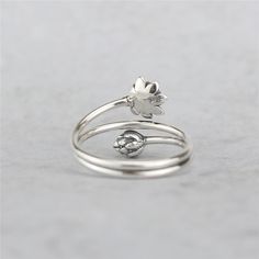 Gorgeous, one-of-a-kind lotus ring Made of 100% real 925 sterling silver Reminding you to be mindful Attract all good things Ring size adjustable / Surface width: 14mm (0.55in) Limited - NOT available in stores Worldwide Shipping Available & 100% Money-Back Guarantee Lotus is symbolic of purity of the body, speech, and mind as while rooted in the mud, its flowers blossom on long stalks as if floating above the muddy waters of attachment and desire. It is also symbolic of detachment as drops of w Adjustable Silver Flower Ring, Adjustable Open Flower Ring In White Gold, Adjustable White Gold Flower Open Ring, Adjustable White Gold Open Flower Ring, Spiritual Silver Adjustable Flower Ring, Adjustable Silver Spiritual Flower Ring, Silver Flower Ring For Mother's Day, Adjustable Spiritual Silver Flower Ring, Delicate Adjustable Silver Flower Ring