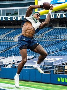 a man jumping in the air with a football